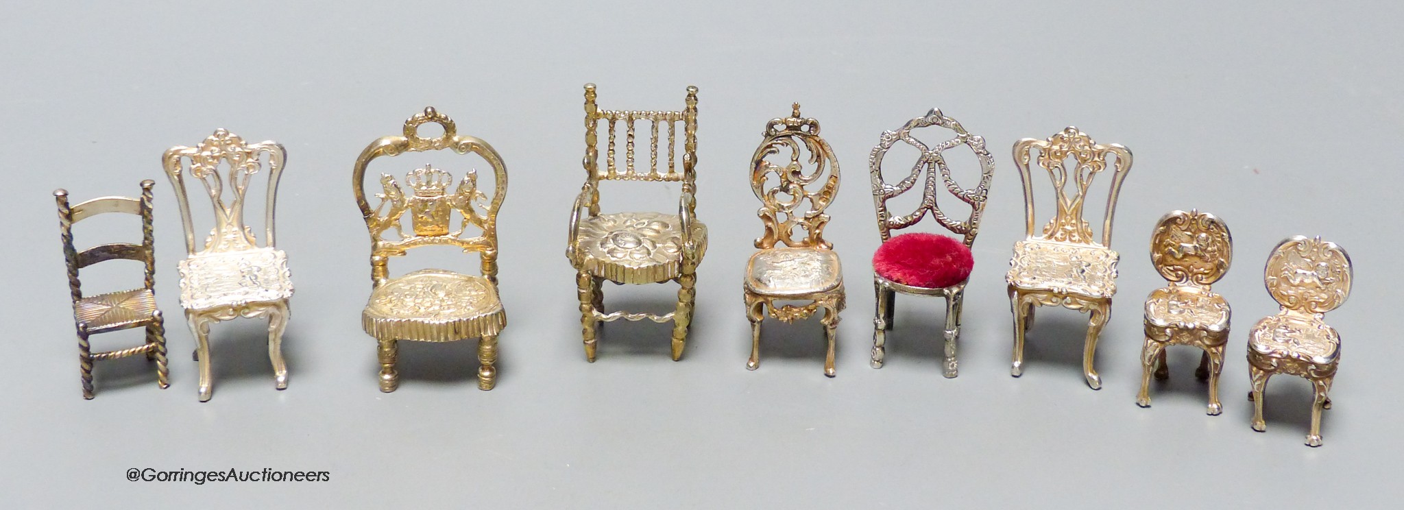 A late Victorian miniature silver model of a chair, 57mm, one other Edwardian chair, two pairs of modern silver chairs and three continental chairs including Dutch.